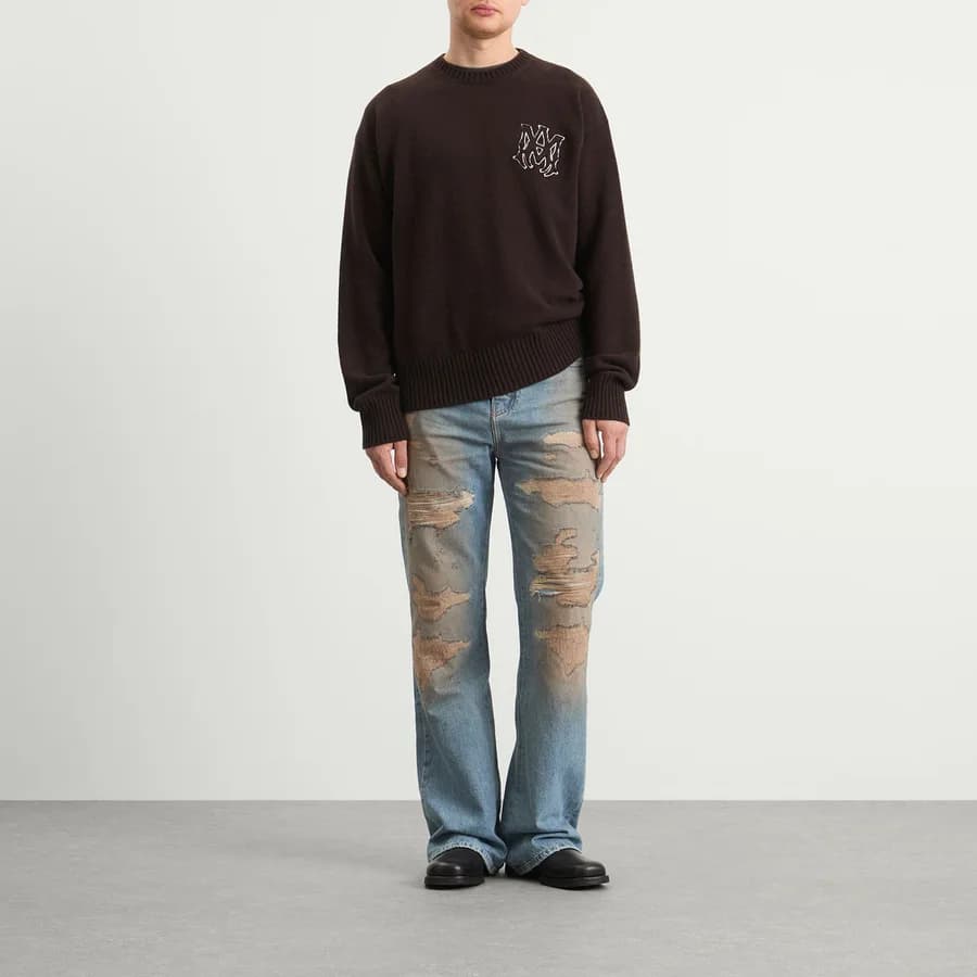 Repaired Boot Cut Jeans — Medium Tinted Indigo — on model