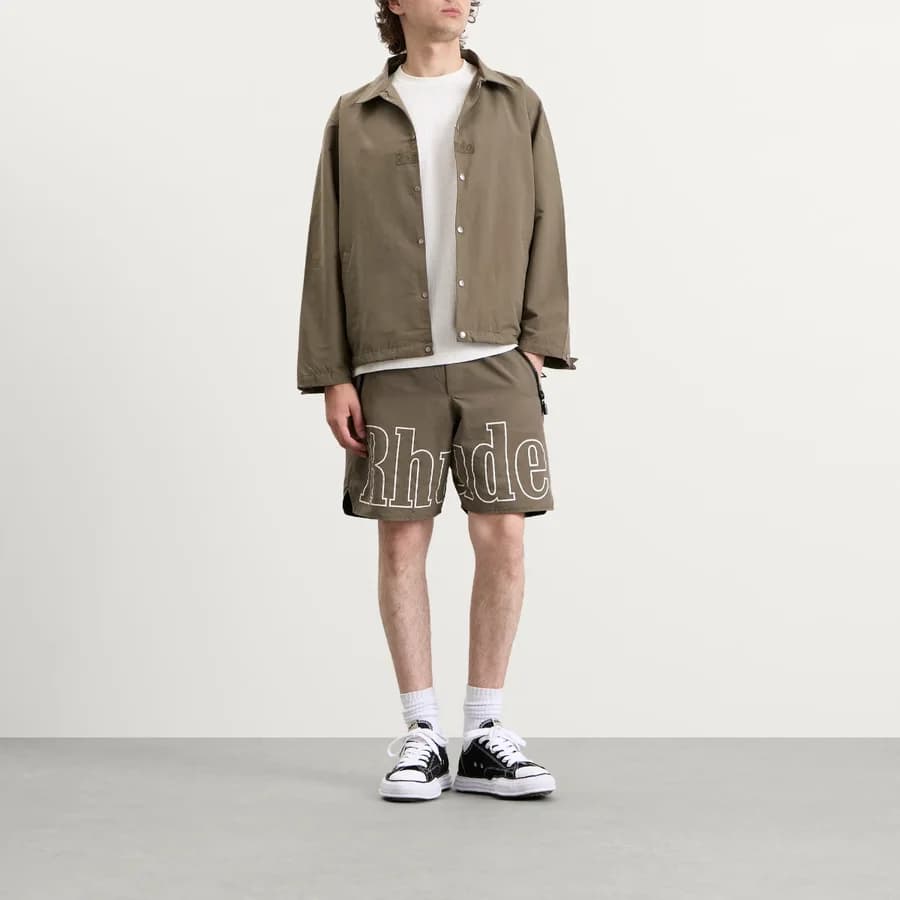 Logo Coaches Jacket — Taupe / Taupe — on model